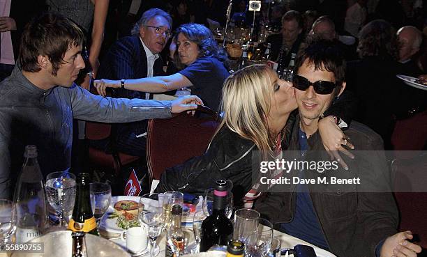 Oasis members Liam Gallagher and Andy Bell and Gallagher's partner Nicole Appleton attend The Q Awards, the annual magazine?s music awards, at...