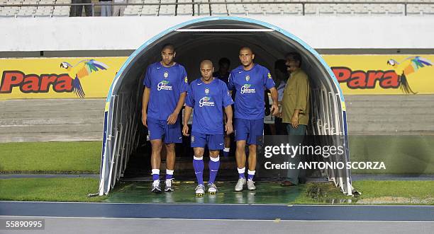 Brazil's soccer stars : Adriano, Roberto Carlos and Ronaldo Nazario leave the tunnel 10 October, 2005 for a training session in Belem, northern...