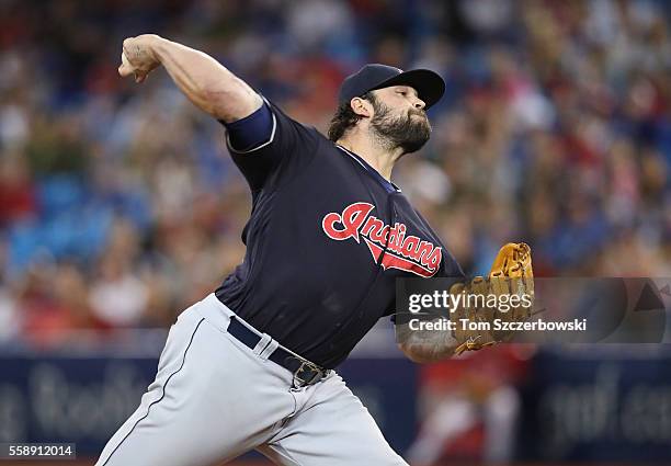 Joba Chamberlain of the Cleveland Indians delivers a pitch in the fourteenth inning during MLB game action against the Toronto Blue Jays on July 1,...