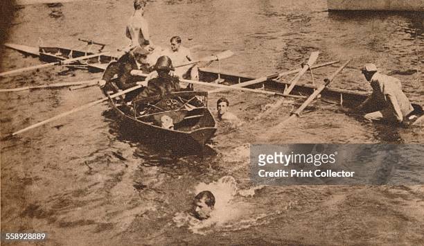 The University Boat Race, March 1912 . Both the Oxford and Cambridge boats sank during the race, swamped by rough waters in the Thames. From The...