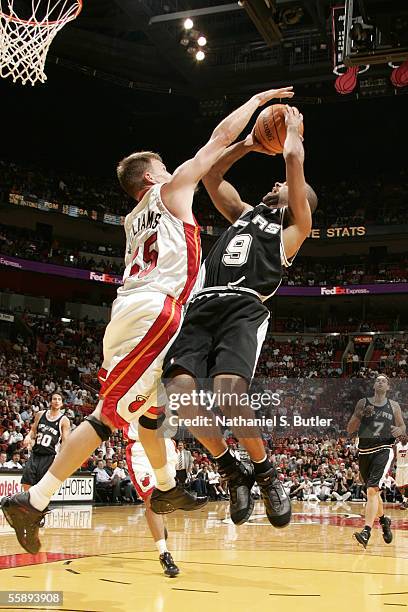 Tony Parker of the San Antonio Spurs shoots against Jason Williams of the Miami Heat during the Hurricane Katrina Relief Benefit Game on October 10,...