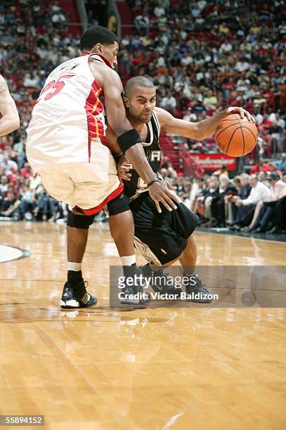 Tony Parker of the San Antonio Spurs drives against Wayne Simien of the Miami Heat during the Hurricane Katrina Relief Benefit Game at American...