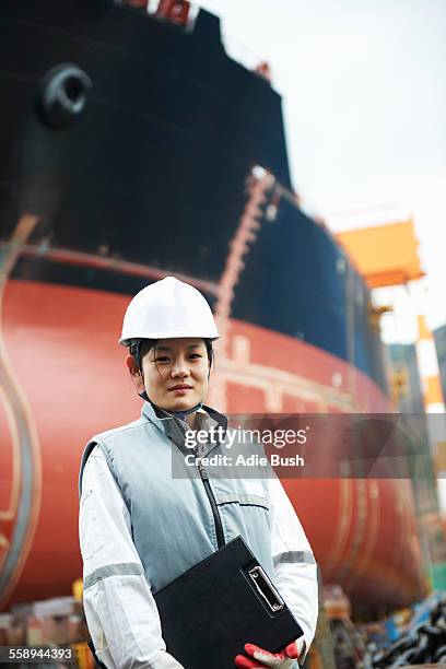 portrait of female worker at shipyard, goseong-gun, south korea - ship building stock-fotos und bilder