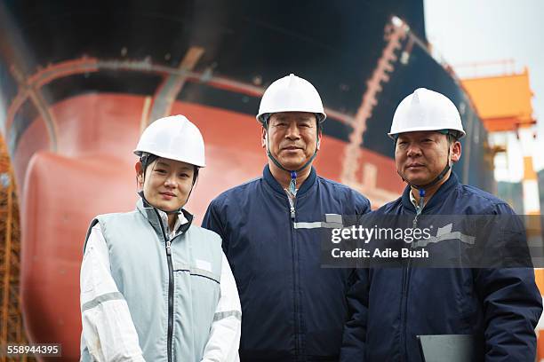 portrait of workers at shipyard, goseong-gun, south korea - shipbuilder stock pictures, royalty-free photos & images