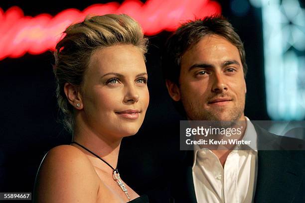 Actress Charlize Theron and actor Stuart Townsend arrive at the Warner Bros.premiere of "North Country" held at the Grauman's Chinese Theatre on...