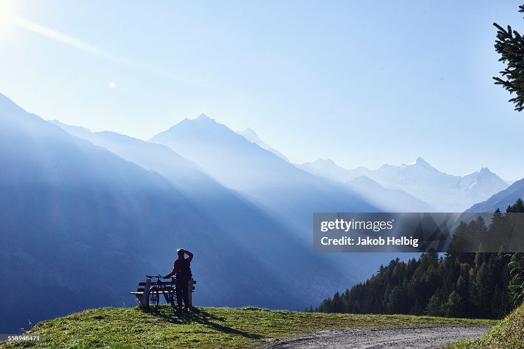 Mountain biker in mountains, Valais, Switzerland