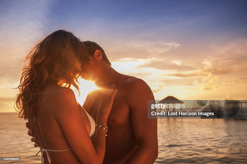 Couple hugging on vacation, Ari Atoll, Maldives