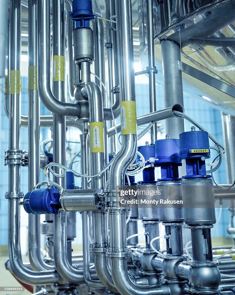 Close up of pipes and connections in brewery