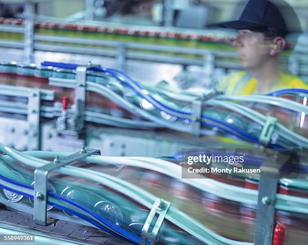 worker inspecting canning line in brewery - food and drink industry ストックフォトと画像