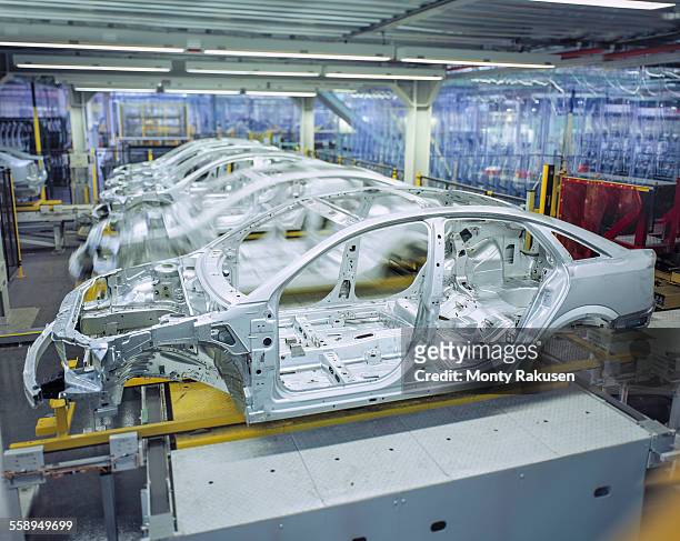 car bodies on production line in car factory - car assembly line control stock pictures, royalty-free photos & images