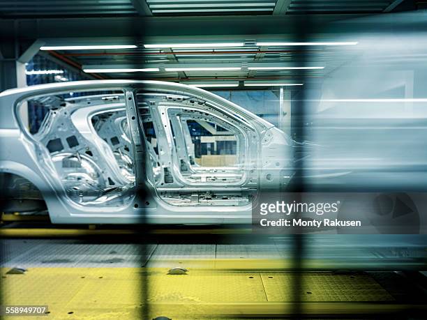 car bodies on production line in car factory - car assembly line control stock pictures, royalty-free photos & images