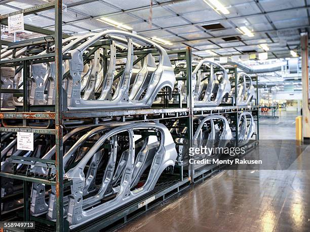 car body parts in storage in car factory - car assembly line control stock pictures, royalty-free photos & images