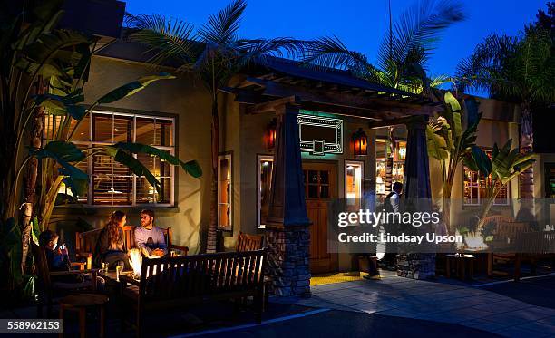 customers dining out by restaurant open fire - mill valley stock pictures, royalty-free photos & images