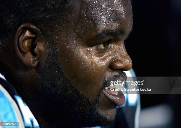 Brentson Buckner of the Carolina Panthers sits on the sideline during the game with the Green Bay Packers on October 3, 2005 at Bank of America...