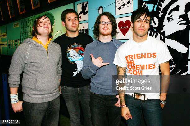 Pete Wentz, Patrick Stump, Joseph Trohman, and Andrew Hurley of Fall Out Boy pose for a photo backstage during MTV's Total Request Live at the MTV...