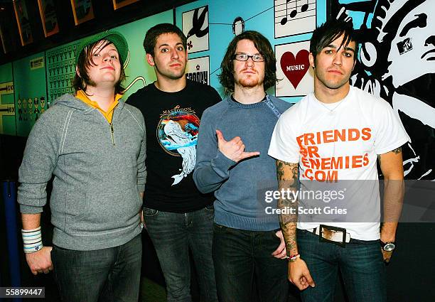 Pete Wentz, Patrick Stump, Joseph Trohman, and Andrew Hurley of Fall Out Boy pose for a photo backstage during MTV's Total Request Live at the MTV...