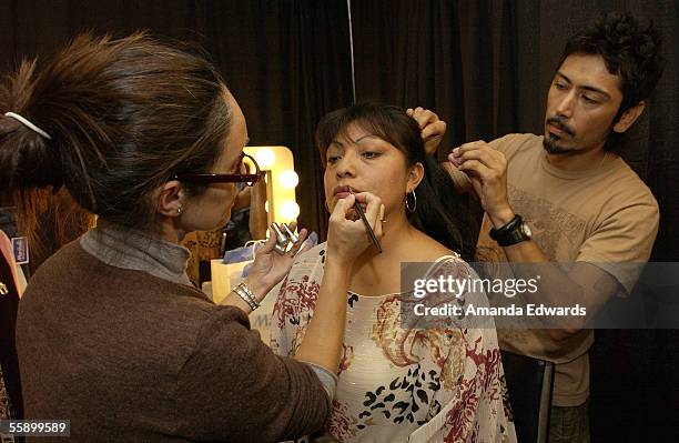 Makeup artist Lucienne Zammit and hairstylist Philip Carreon give domestic violence survivor Judith a makeover at Bea's Room on October 11, 2005 in...