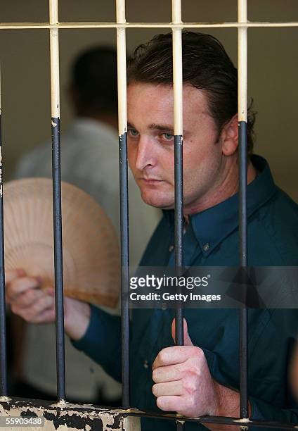 Australian Martin Stephens waits in the holding cell in the Denpasar District Court at the beginning of his trial on October 12, 2005 in Denpasar,...