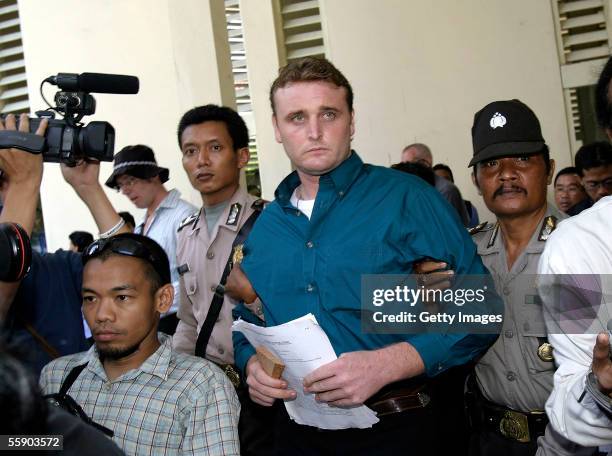 Australian Martin Stephens is escorted to his appearance in Denpasar District Court at the beginning of his trial on October 12, 2005 in Denpasar,...