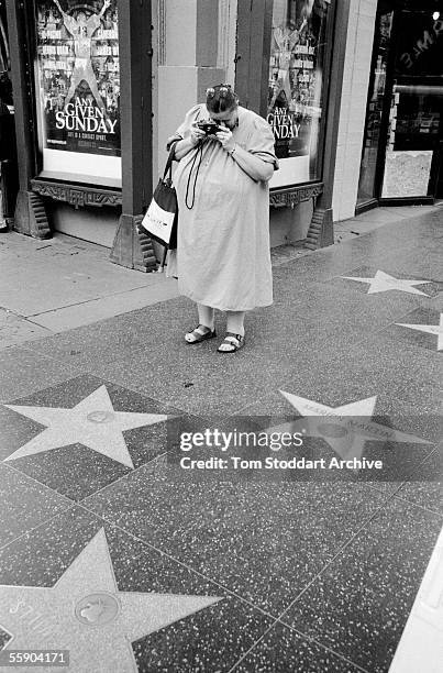 In 1911 the first motion picture was made in a suburb of Los Angeles, South California, since then Hollywood, or 'Tinsel Town' so called because of...