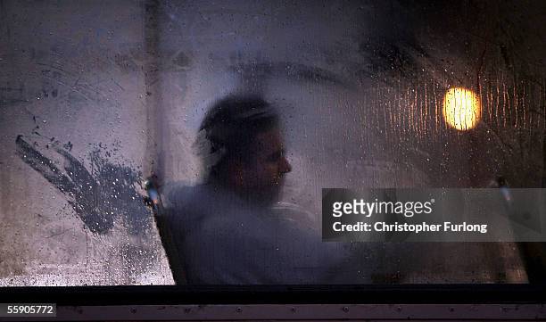 Man makes his way home from work on a bus as darkness falls on October 10, 2005 in Glasgow, Scotland. Seasonal affective disorder , or winter...
