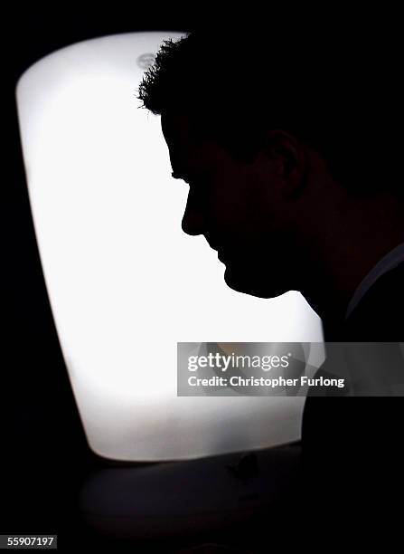 Man suffering from Seasonal Affective Disorder uses a light box in his office to combat the illness on October 12 2005 in Glasgow, Scotland. Seasonal...