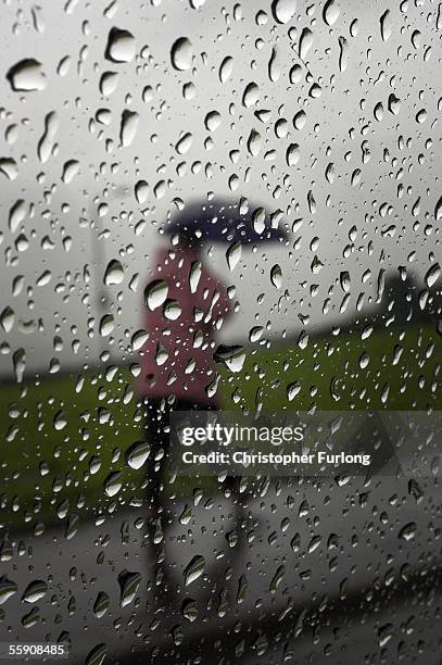 Woman makes her way home through the incessant on October 11, 2005 Glasgow, Scotland. Seasonal affective disorder , or winter depression, is a mood...