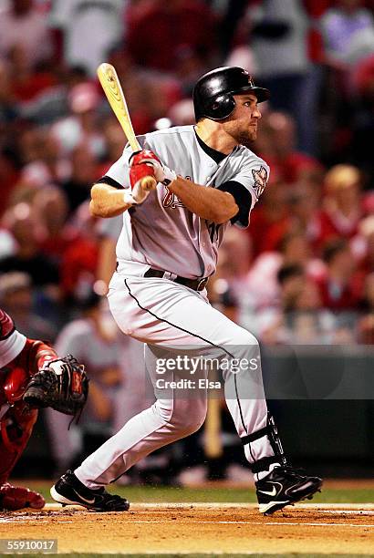 Lance Berkman of the Houston Astros hits a double in the second inning against the St. Louis Cardinals in Game One of the 2005 National League...