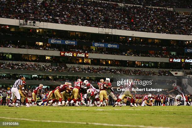 Signs for Corona beer and Coca Cola are shown at Estadio Azteca during the Arizona Cardinals game against the San Francisco 49ers on October 2, 2005...