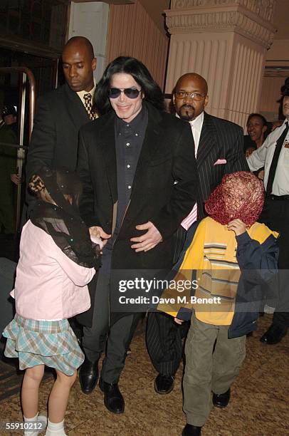 Singer Michael Jackson walks with his children, Prince and Paris, as they visit Harrods October 12, 2005 in London, England.