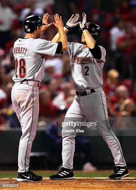 Chris Burke of the Houston Astros is congratulated by Adam Everett after Burke hit a pinch-hit two-run home run in the seventh inning against the St....