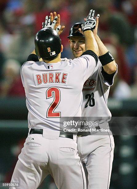 Chris Burke of the Houston Astros is congratulated by Adam Everett after Burke hit a pinch-hit two-run home run in the seventh inning against the St....