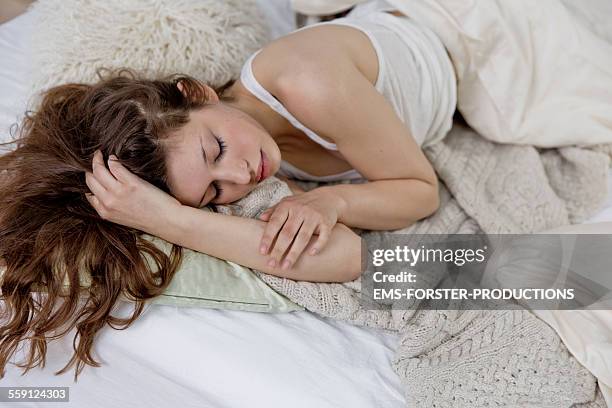 woman chilling in bed - unterhemd stock-fotos und bilder