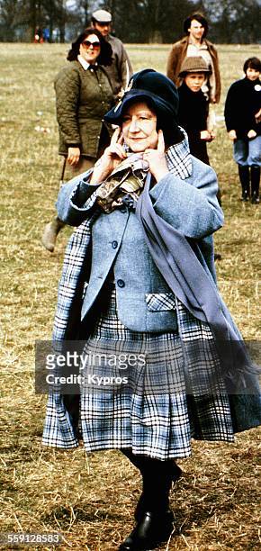 The Queen Mother with her fingers in her ears, circa 1979.