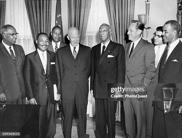 President Dwight D Eisenhower poses in his office today with four civil rights leaders following their conference on problems of school integration...