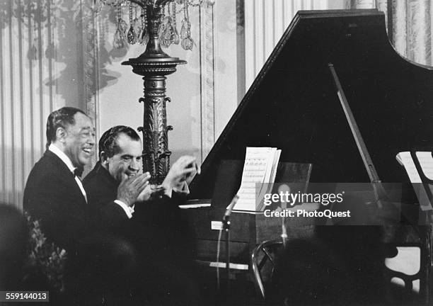American President Richard M Nixon plays 'Happy Birthday' for guest Duke Ellington after a White House dinner in honor of Ellington's 70th birthday,...