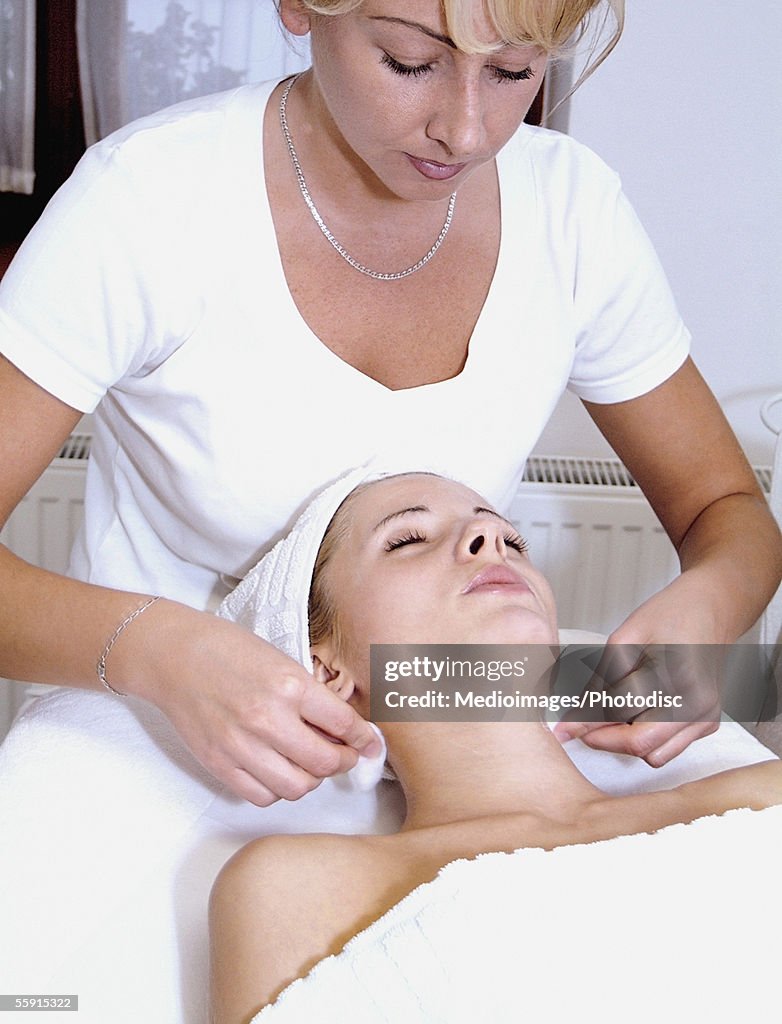 Mid adult woman getting a beauty treatment