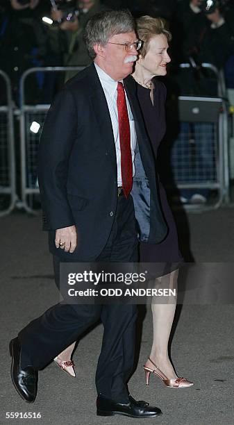 London, UNITED KINGDOM: US ambassador to the UN John Bolton and his wife Gretchen arrive for former British Prime minister Lady Margaret Thatcher's...