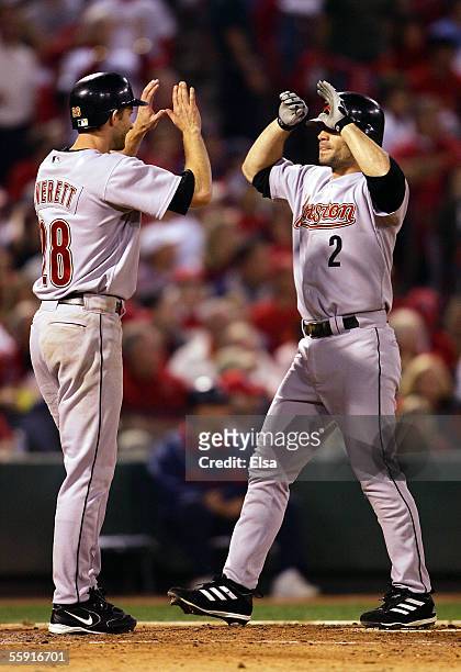 Chris Burke of the Houston Astros is congratulated by Adam Everett after Burke hit a pinch-hit two run home run in the seventh inning against the St....