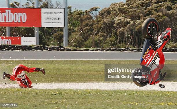 Loris Capirossi of Italy and the Ducati Marlboro Team crashes heavily during practice for the Australian MotoGP at the Phillip Island Circuit on...