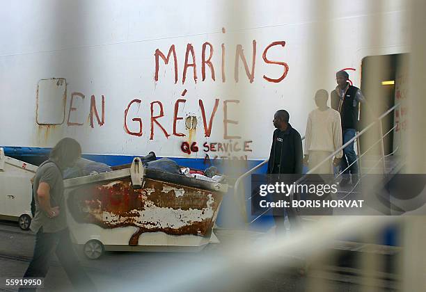 Workers at the state-owned ferry operator the National Corsica Mediterranean Company wait for a general assembly aboard of Mediterranee ferry, 14...