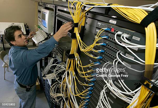 Sergio Salgado works at the control center at the end of the digital trunk that links all the homes in the Sunriver housing development October 13,...