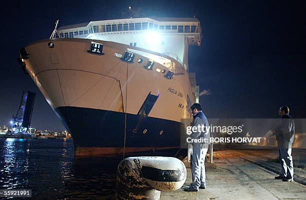 Workers throw off the lines of the National Corsica Mediterranean Company ferry Paglia Orba before it leaves the port of Marseille as France's...