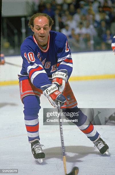 Canadian professional hockey player Guy Lafleur of the New York Rangers excitedly angles for the puck during away game action, 1980s.