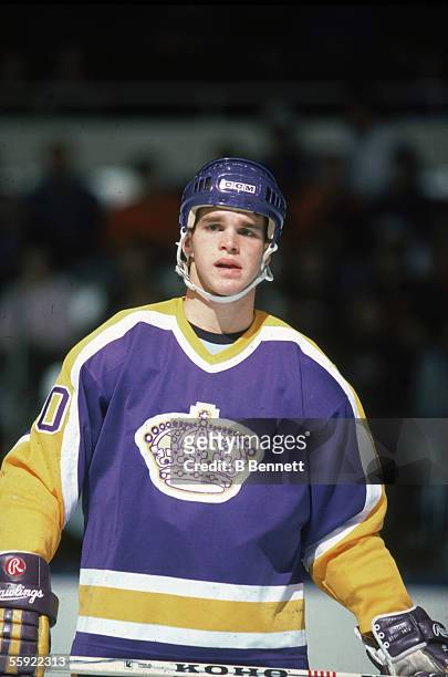 Portrait of Canadian pro hockey player Luc Robitaille of the Los Angeles Kings on the ice during an away game, 1980s.