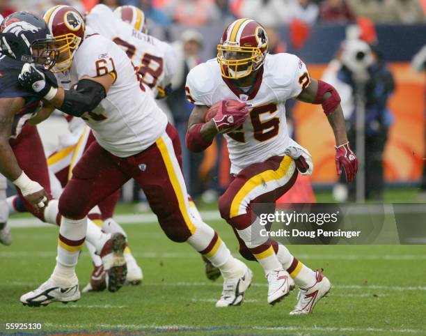 Clinton Portis of the Washington Redskins carries the ball during the game against the Denver Broncos during game at Invesco Field at Mile High on...