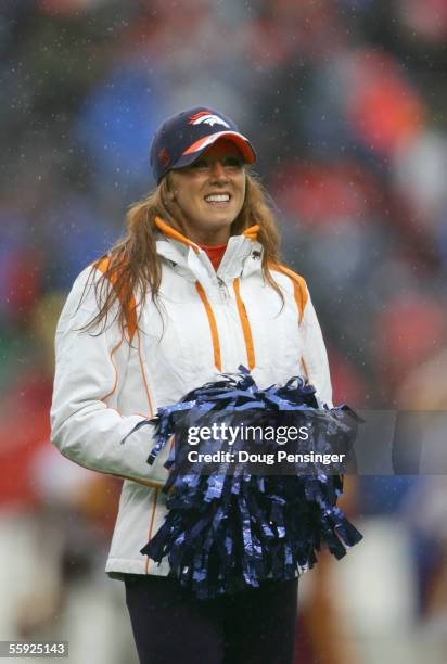 Cheerleader of the Denver Broncos smiles on the field during the game against the Washington Redskins at Invesco Field at Mile High on October 9,...