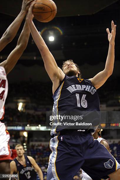 Pau Gasol of the Memphis Grizzlies grabs a rebound against the Miami Heat during preseason NBA action at Coliseo de Puerto Rico Jose Mario Agrelot on...