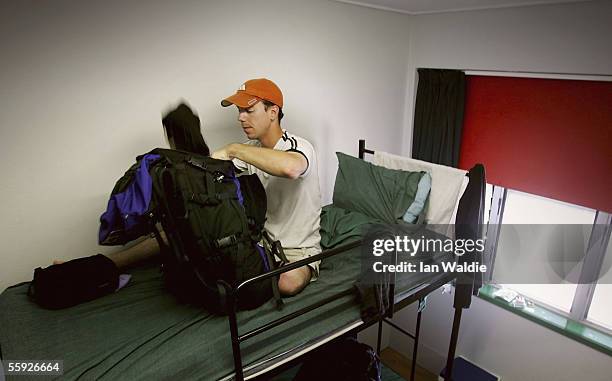 Traveller Craig Weather unpacks his pack at a backpackers hostel October 14, 2005 in Darwin, Australia. The backpacking industry in Darwin, the...