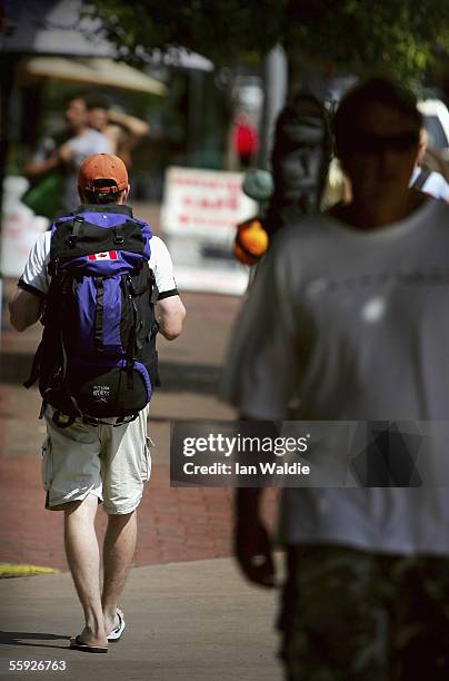 Backpacker Craig Weather from Canada walks through the streets of Darwin October 14, 2005 in Darwin, Australia. The backpacking industry in Darwin,...